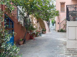 Chania old town architecture. Crete island, Greece.  Countryard, traditional buildings and flower pots