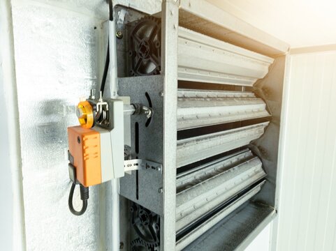 Close up the air damper actuator with automation open  close  damper blades on the ventilation duct.