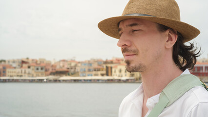Tourist admiring chania cityscape in crete, greece: a serene travel moment