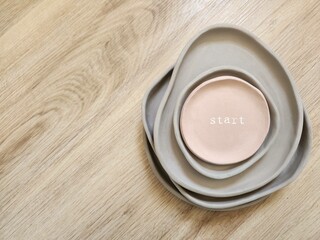 homemade artisanal dishes with earthy colors written start