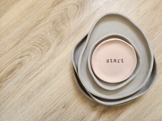 homemade artisanal dishes with earthy colors written start