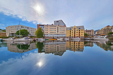 Cityscape of Alesund city on a sunny summer day, Norway. View of colorful Art Nouveau architecture port