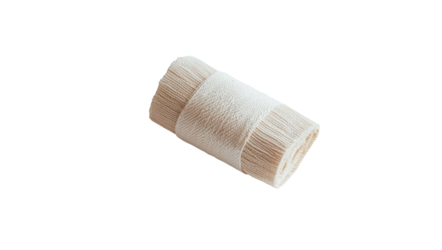 Rolled-up bundle of light beige fabric