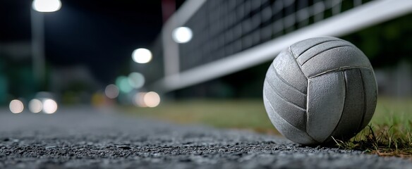 Gray volleyball on a night street