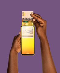 Black African hand Withdrawing pulling removing transferring Ugandan shilling notes through smart mobile phone screen. Online banking transfer receiving payment. money business transaction concept app