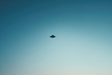 single ufo silhouette against vast clear sky highlights world ufo day with ample copy space for text