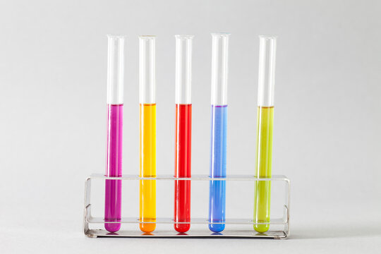 Close-up of five Test Tubes filled with multi coloured liquid in a test tube rack