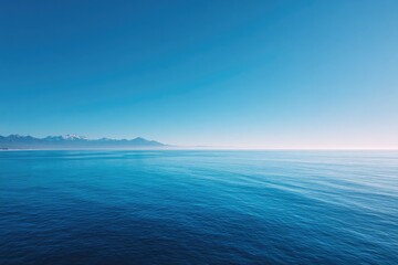 vast horizon over tranquil sea under clear sky highlighting nature simplicity