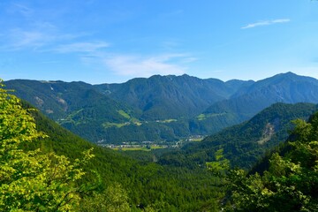 View of Gozd Martuljek village in a valley bellow the forest covered Karavanke mountains in Gorenjska, Slovenia
