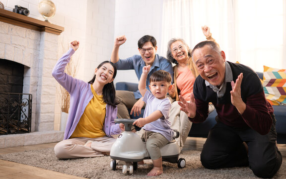 Happy multi-generational Asian family enjoying quality time together at home - Powered by Adobe