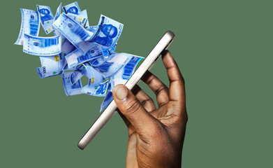 Black African Hand holding mobile phone with many Nigerian Naira coming spitting flying out of the screen on green background. side view of phone