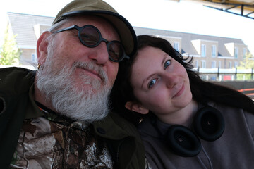 An affectionate relationship between grandfather and granddaughter. The girl is a 15 year old...