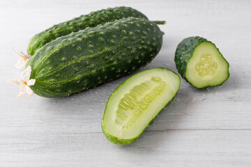 homemade cut cucumbers on white table, close-up