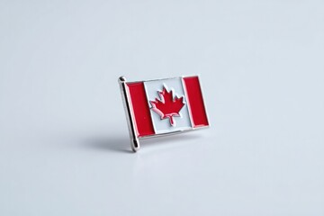 minimalistic image of small canadian flag lapel pin with simple white background and ample copy space evokes clean