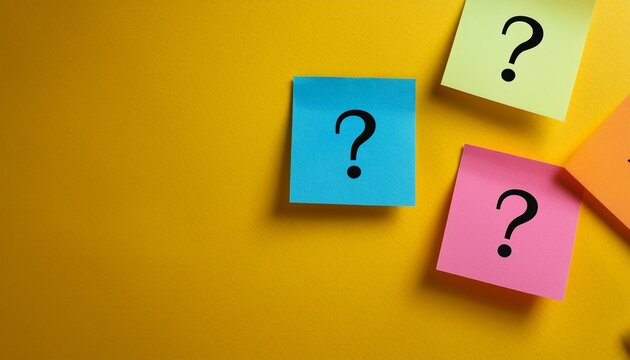 colorful sticky notes with question marks on yellow background
