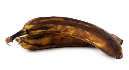 Two overripe bananas with blackened peel isolated on white background.