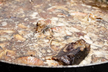 Lamb meat being cooked in a stew