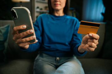 Woman Shopping Online Using Smartphone and Credit Card