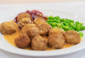 Traditional Swedish meatballs with peas and lingonberry