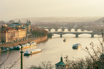 Scenic Prague view with Charles Bridge and boat traffic