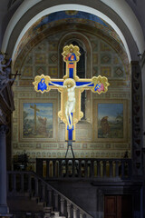 Tempera and gold painted crucifix by Giotto, c. 1315, originally placed above the presbytery, now in the left transept of Ognissanti Church, Florence, Italy.