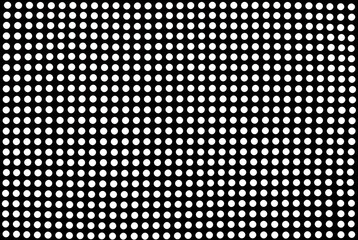 A polka dot pattern of white dots on a black background