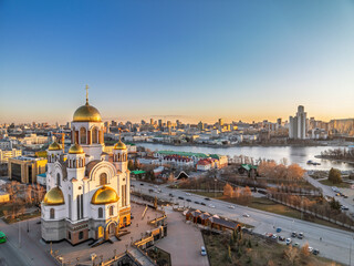 Early spring or autumn Yekaterinburg and Temple on Blood in clear sunset. Aerial view of Yekaterinburg, Russia. Translation of the text on the temple: Honest to the Lord is the death of His saints.