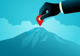Business goal targeting, hand placing location pin on mountain peak