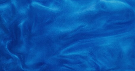 Abstract background. The blue shiny liquid is bubbling and shimmering