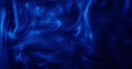 Abstract background. The blue paint with sparkles is bubbling and shimmering