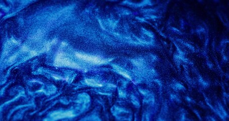 Abstract background. The blue paint with sparkles is bubbling and shimmering