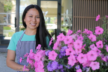 Greenhouse worker wearing an apron 