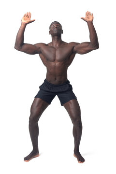 front view of a man wearing shorts pushing something imaginary upwards