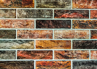 Colorful Brick Wall Texture: Artistic and Vibrant Background for Creative Projects. The bold colors and rough surface provide a dynamic urban feel, making it ideal for modern and abstract.