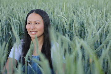Pretty South American woman in agricultural fields