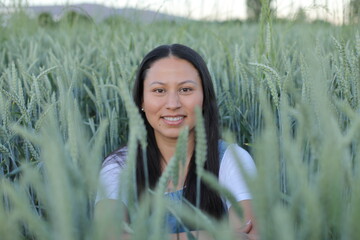 Pretty South American woman in agricultural fields