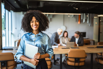 Portrait of a beautiful african american businesswoman hold laptop