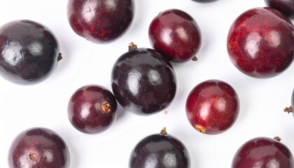 Icacinas on Isolated White Background – Small African Berry-Like Fruit with Glossy Surface and Natural Macro Detail
