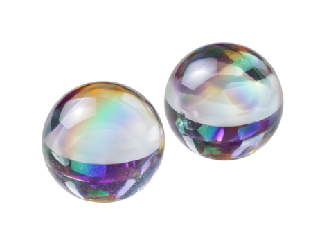 Two iridescent glass spheres showcase vibrant colorful reflections and refractions against a stark white background, highlighting their unique aesthetic beauty and form.