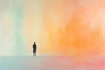 A man stands in front of a colorful background. A solitary figure emerges in a pastel hued space capturing a sense of calm and contemplation.