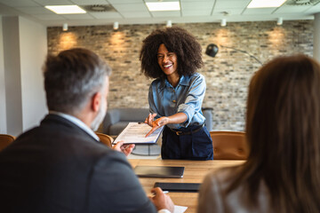 African american businesswoman hold formal business document for signature