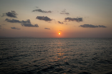 Sunset in the gulf of Thailand, Image shows a nice calm sea during golden hour with a sky full of colour and few clouds