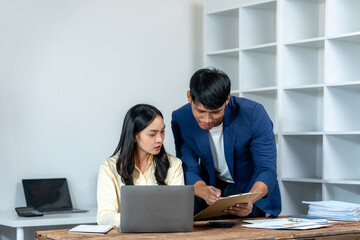 Business Colleagues Discussing Documents in Office