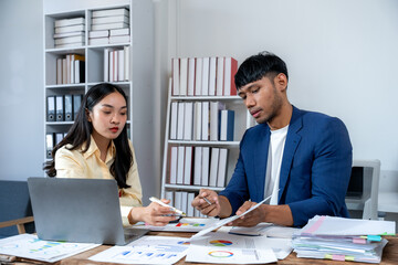 Business Colleagues Analyzing Financial Data in Office