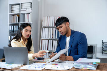 Business Colleagues Analyzing Financial Data in Office