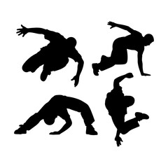 Silhouettes of four parkour practitioners performing various dynamic movements and acrobatic poses in black
