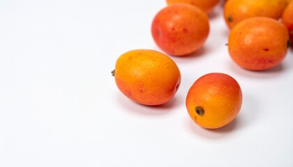 Jocotes on Isolated White Background – Small Orange to Red Spondias Fruit with Tart Flavor and Natural Macro Focus