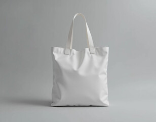 Blank white tote bag mockup on gray background