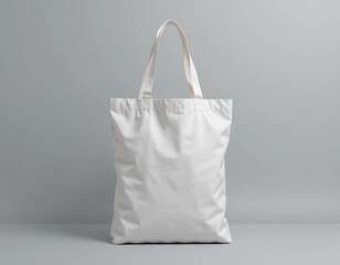 Blank white tote bag mockup on gray background