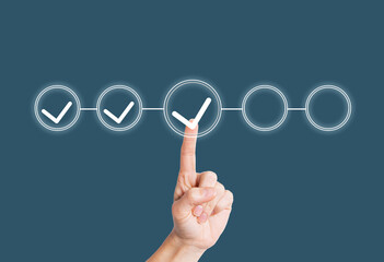 A woman's hand points to a progress bar, shows the task management process, the efficiency of the...